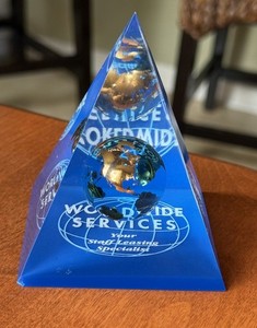 Worldwide Services Lucite Pyramid W /Suspended Gold Colored Globe