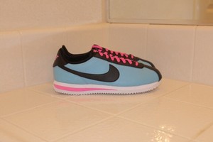 black and blue nike cortez