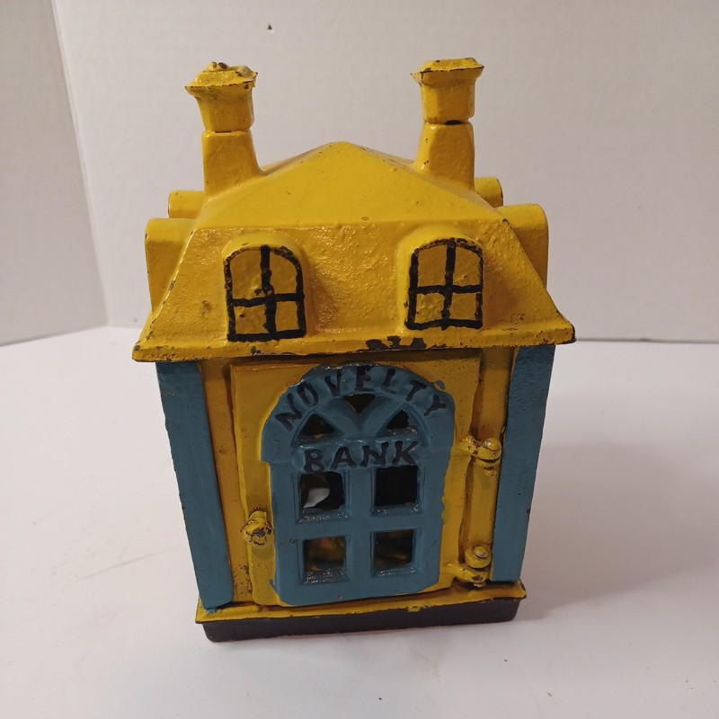 Mechanical Cast Iron Novelty Bank Building with Teller