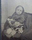 ANTIQUE 2 1/4" X 3 5/8" TIN TYPE PHOTOGRAPH OF YOUNG GIRL HOLDING HER DOLL