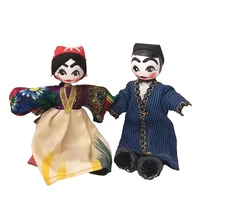 PAIR OF TRADITIONAL UZBEK CLOTH DOLLS - DRESSED IN IKAT AND BEKASAM CHAPPAN