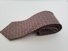 Men tie brown and white paisley pattern on a light brown background, hand sewn,