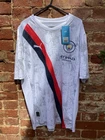 New with tags. Manchester City Puma Silver, Red & Black Shirt - Large