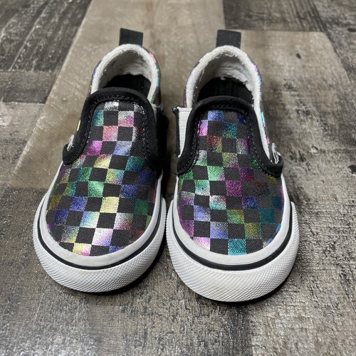 black colored checkerboard vans