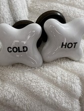 Vintage Porcelain Tub Faucet with Hot and Cold Cross Handles.