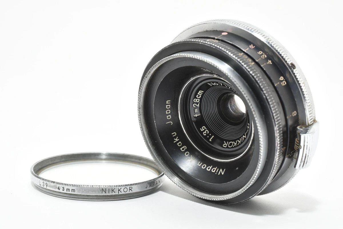 Nikon F 中期 ボディ + Auto Nikkor 28mm F3.5 Nikon New NIKKOR 28mm F3.5 | ヨアケマエカメラ フィルムカメラ修理・販売