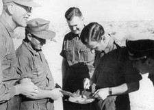 Military doctor Enemy soldiers Egyptian front examining reptile se- WWII Photo