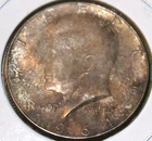 1964 Kennedy Half Dollar With Heavy Obverse Toning in Uncirculated Condition
