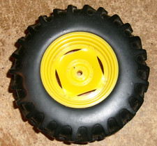 1/16 john deere 4.5" dia. x 1.25"W plastic rim long/short bar rubber tire used