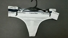 2 CALVIN KLEIN THONGS, SIZE M.
