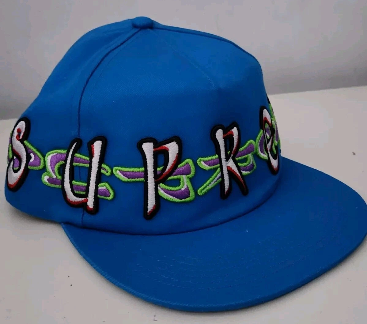 FW23 Supreme AOI Spellout 5 panel blue hat cap embroidered artwork by aoi