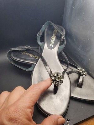 Yves Saint Laurent crystal-embellished thong sandals. They feature a sleek,...