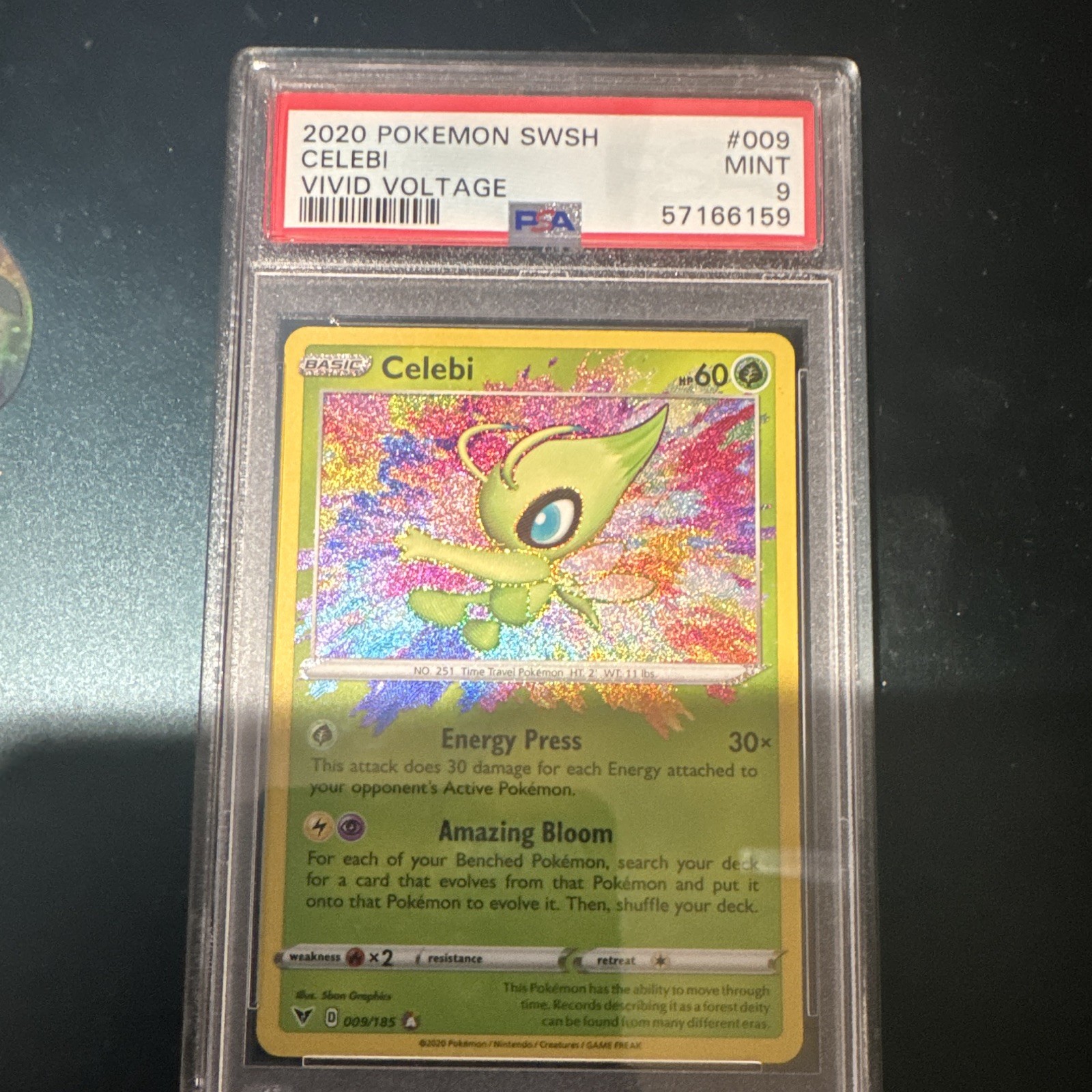 The Pokémon Company 2020 Vivid Voltage Celebi Amazing Rare Holo 009/185 PSA 9