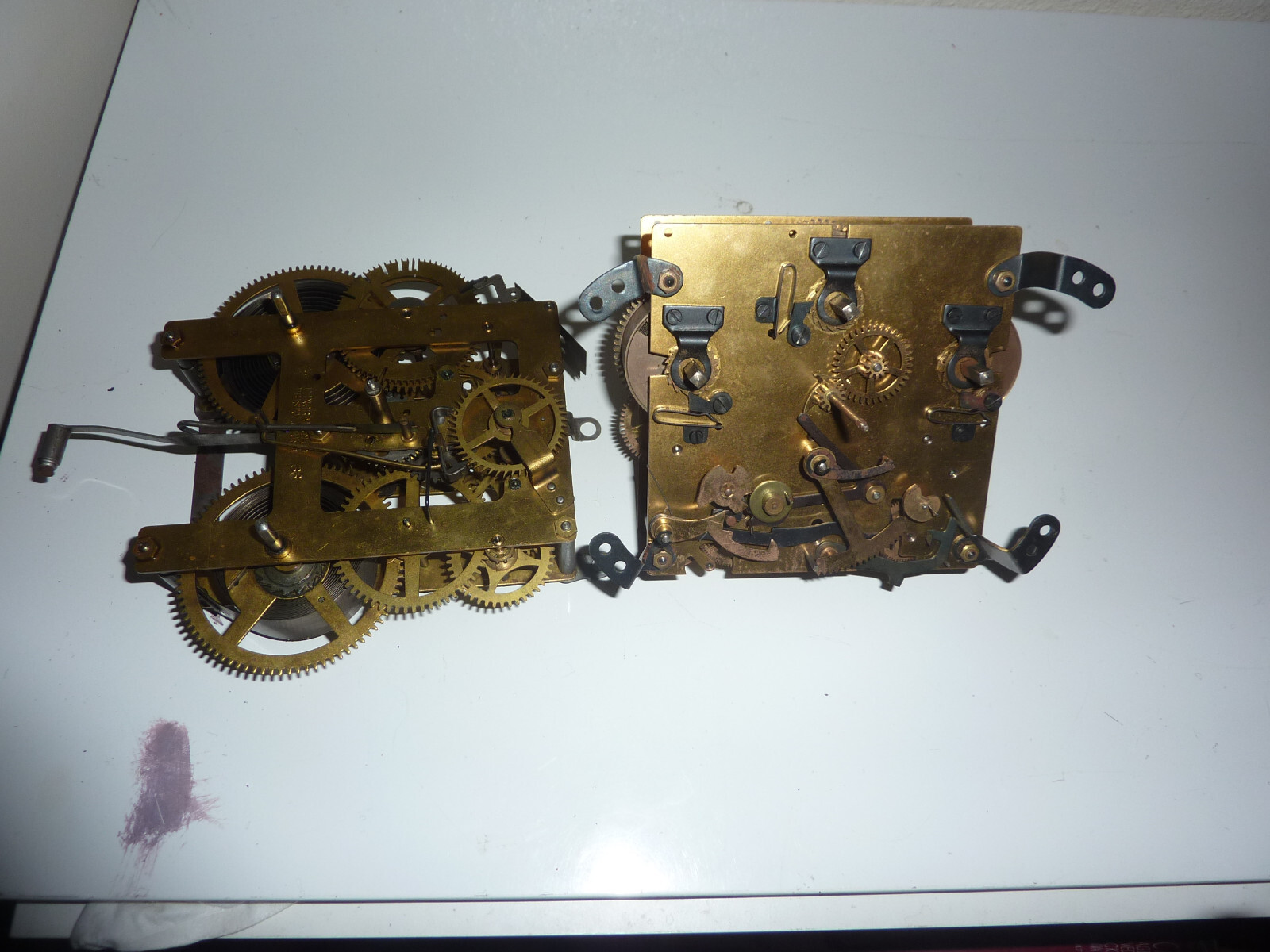 2 antique clock movements ONE E INGRAHAM 33 PARTS & movement with no