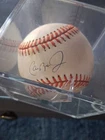 cal ripken jr signed baseball, Authenticated  By  GA GLOBAL, I THINK THEREOUT OF