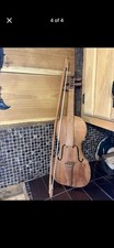Hand-carved wooden violin / fiddle 	  	Includes a wood bow 	  Decorative