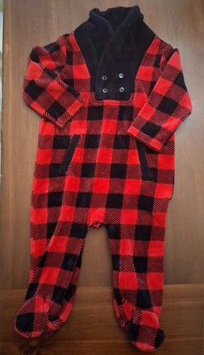 red and black buffalo plaid baby footed sleeper.