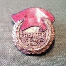 GDR badge - VEB - builder gas combination black pump - gold