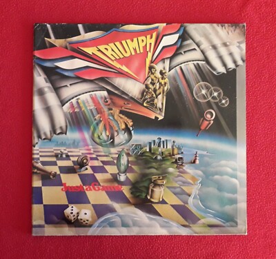 The Triumph - Just a game - 1. deutscher Druck Klappcover - Ex + + + +