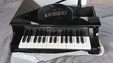 Bridgecraft CHILDRENS GRAND PIANO BLACK NEEDS SOME REPAIR .