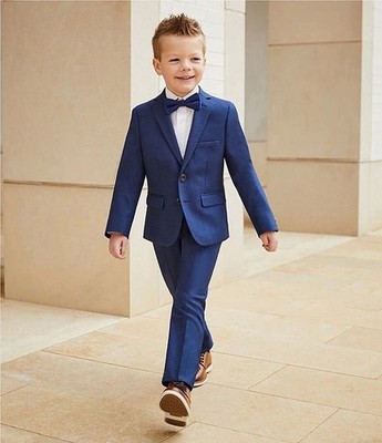 Two-piece boys formal suit with tailored jacket and matching trousers.