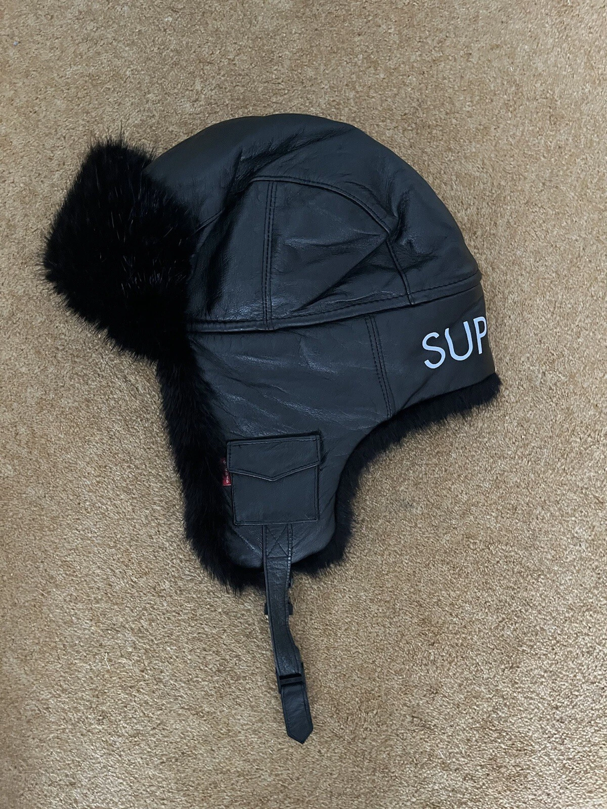 Chapeau à rabat oreille trappeur fourrure cuir véritable noir suprême