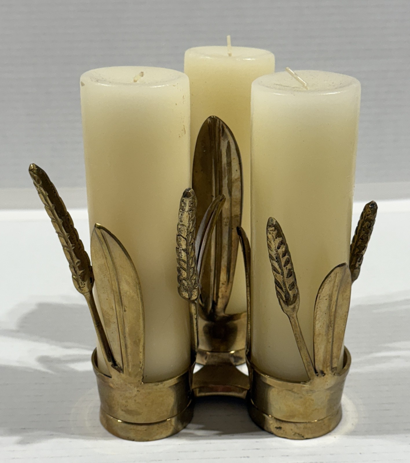 Set of three brass wheat sheaf candle holders, mid-century design