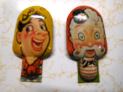 2 Vintage Funny Faces Tin Metal Clickers
