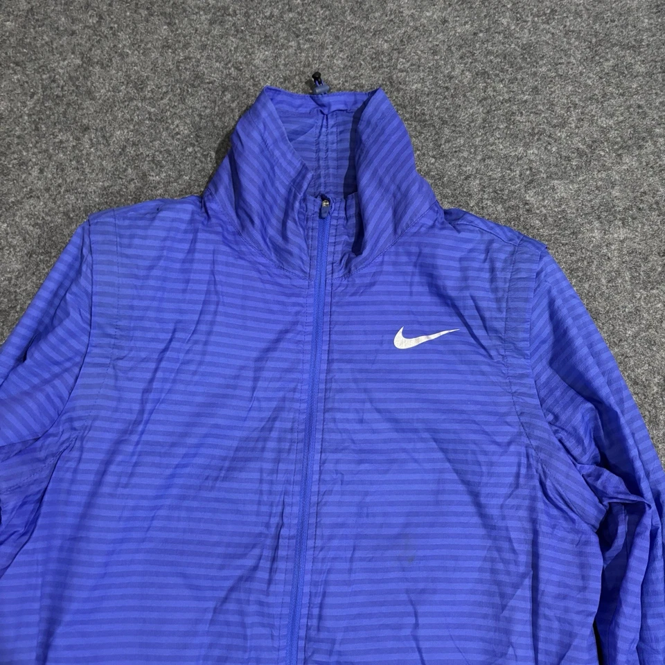 Chaqueta convertible Nike Golf 2 en 1 Majors Flight para mujer azul medio cremallera completa Foto 3 de 4