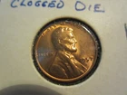 A 1957-D WHEAT PENNY DIE ERROR CLOGGED 9 AND B AU CONDITION