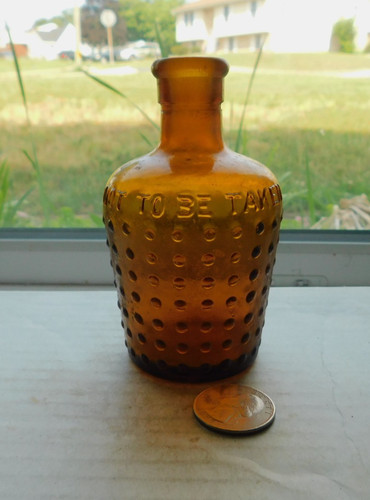 NICE AMBER POISON EMBOSSED, NOT TO BE TAKEN