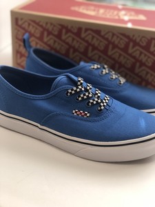 black vans with checkered laces