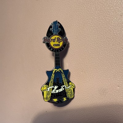 Hard Rock Cafe pin Chicago Vertical Blue Guitar with two Saxophones 2013