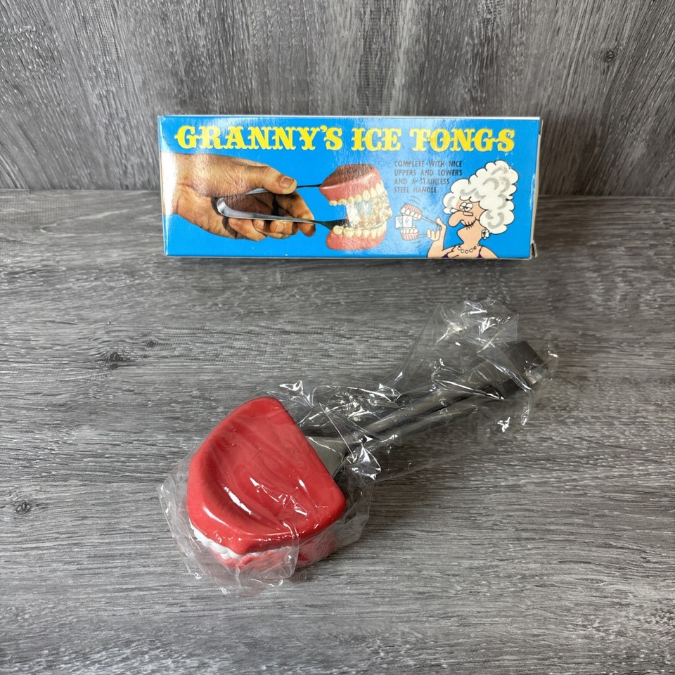 Deadstock 1979 gag ice tongs shaped like giant dentures — a perfectly absurd bar cart conversation piece.
