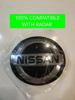 NISSAN VERSA / SENTRA 2020-2021-2022 FRONT GRILLE EMBLEM 62890-6LH0A RADAR COMP - Image 1 of 3