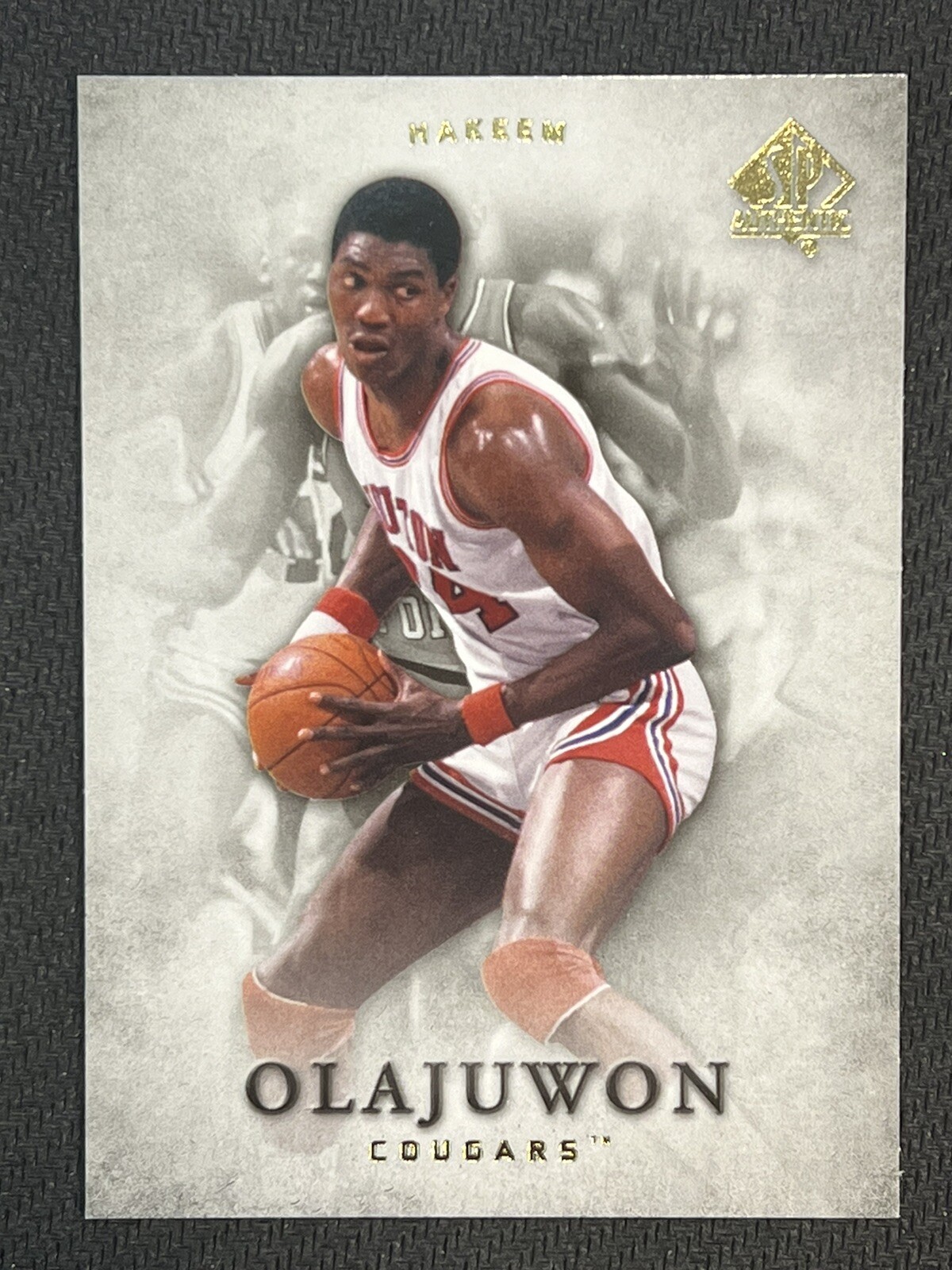 Hakeem Olajuwon #6 Basketball Cards 2012 SP Authentic trading card — raw and PSA graded price guide