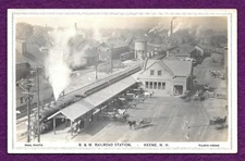 E. 1900s RPPC POSTCARD KEENE N.H. RAILROAD STATION HORSES WAGONS