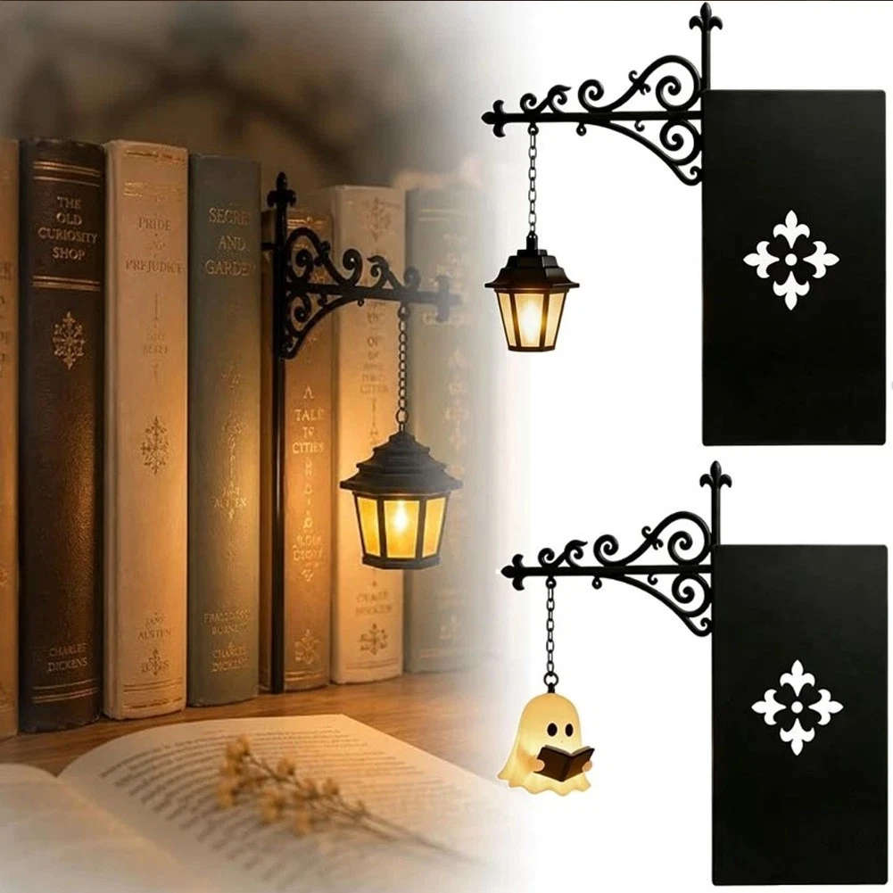 Miniature hanging lantern lights displayed beside books