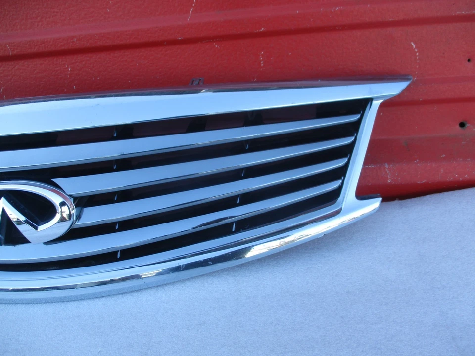 Emblema de rejilla de parachoques delantero Infiniti G25 G37 Q40 2010-2015 OEM 62310-1NF1A Foto 4 de 4