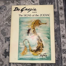 DE GRAZIA PAINTS THE SIGNS OF THE ZODIAC LIMITED EDITION 1971 HARDCOVER SIGNED.