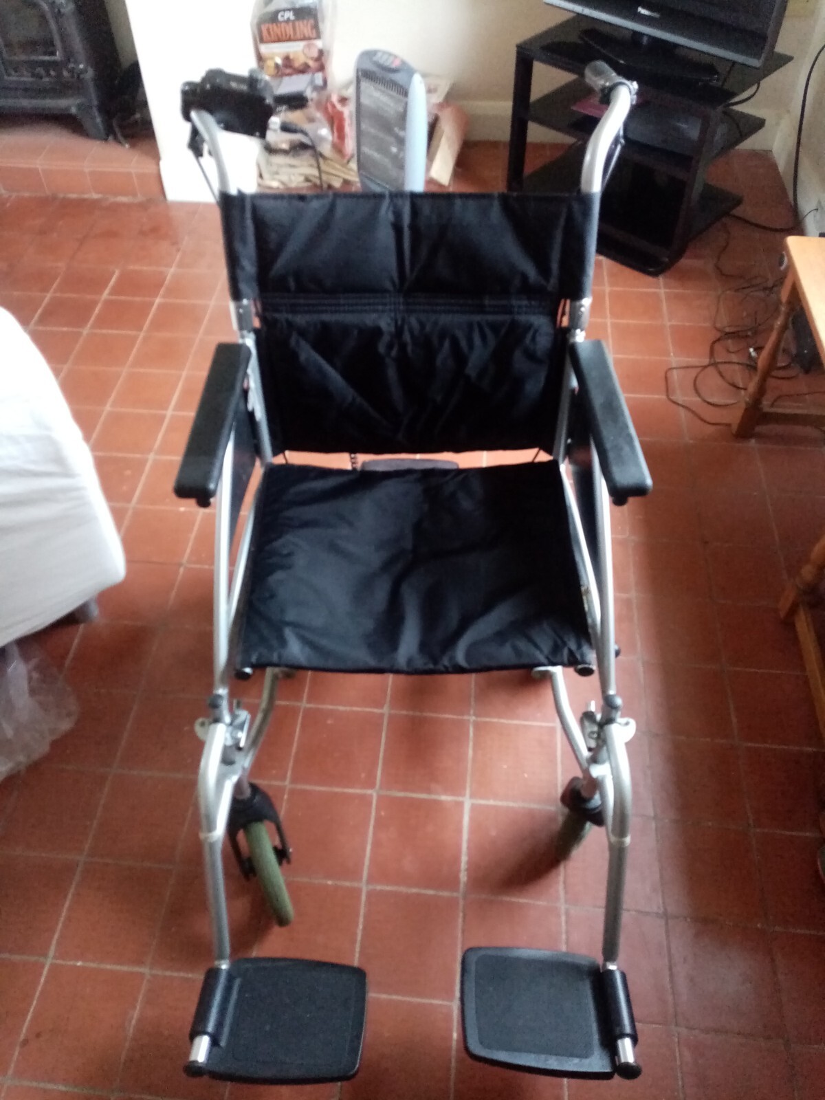 Wheelchair, complete with feet and self propelling option. Used but