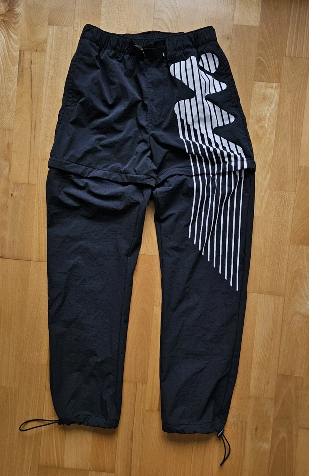 Pantalones cortos/pantalones sin paredes para hombre pequeños de nailon con cremallera convertible negro cinturón de senderismo Foto 3 de 4