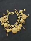 Vintage Miriam Haskell Gold Tone Charm Cha-cha Bracelet
