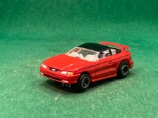 ORIGINAL LIFE LIKE FORD MUSTANG, RED/BLACK, M CHASSIS, NEW UNUSED
