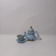 Muniature Fisher-Price Briarberry Bear blue tea set, including a teapot, teacup.