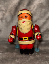 Vintage Tin Santa W/Poles Merry Christmas