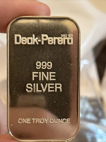 VINTAGE DEAK PERERA  1  TROY OUNCE .999 FINE SILVER BAR