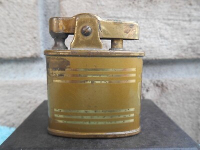 VINTAGE TIKI WIFEU OVAL AUTOMATIC BRASS CIGARETTE LIGHTER. WORKS! MISSING SCREW.