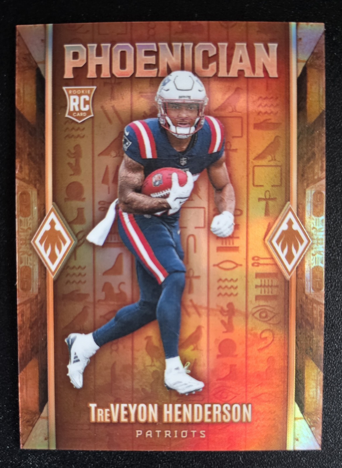 2025 Panini Phoenix Football: Treveyon Henderson: Phoenician no. 18