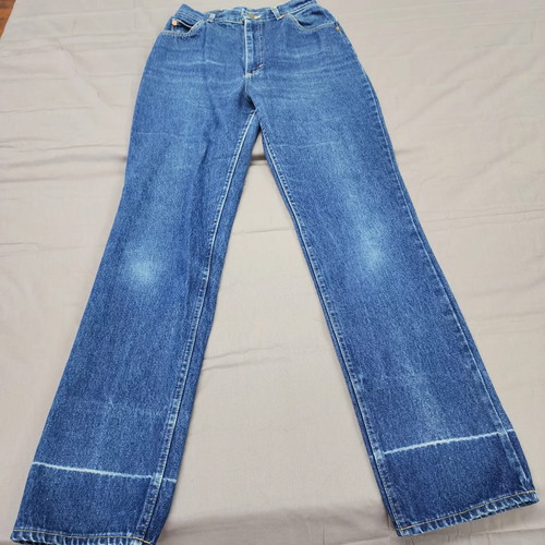 Blue denim high-rise straight legs with faded front thighs, five-pocket design, and visible yellow stitched seams.